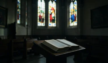 40 Powerful Prayers For 3PM On Good Friday: A solemn church interior with a Bible.